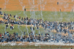 14 شهيدا و 1416 جريحا في مسيرة يوم الأرض بغزة