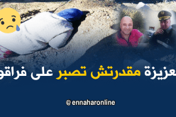 أم تبكي على قبر ابنها الشهيد في فاجعة بوفاريك
