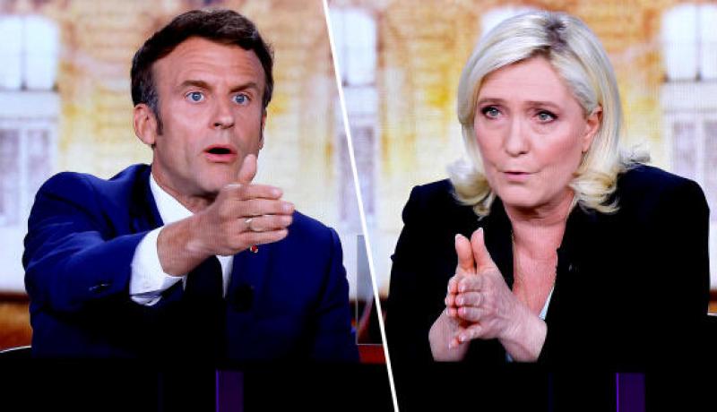 ماكرون يرد على رغبة لوبان في منع الحجاب وطرد المهاجرين من فرنسا